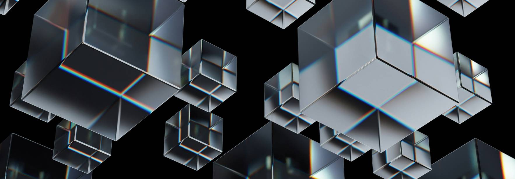 Una serie de cubos transparentes flotan sobre un fondo negro.