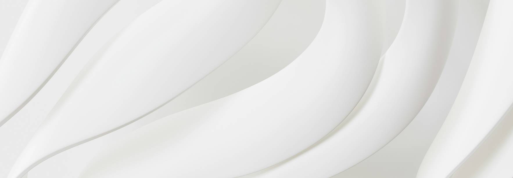 Una superficie blanca con formas onduladas que crean un efecto de profundidad y textura.