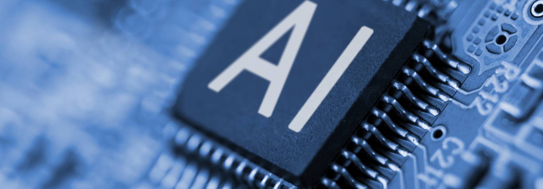 La imagen muestra un chip de ordenador con la inscripción 'AI' en un fondo azul.