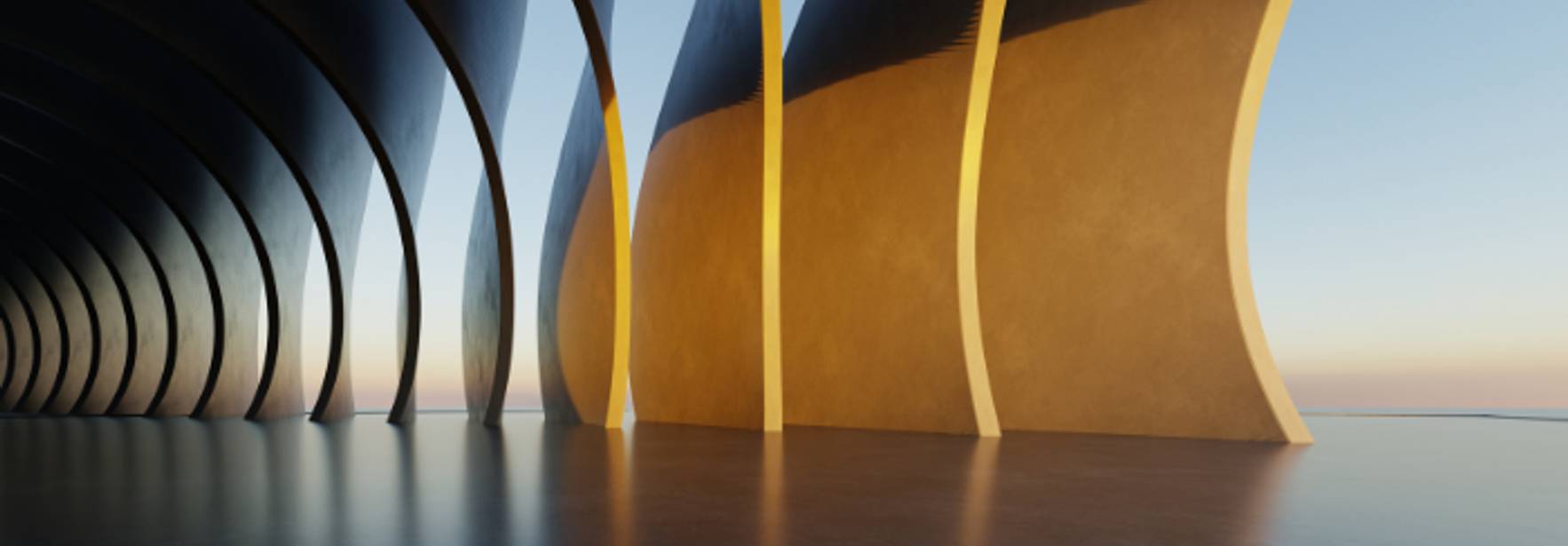 La imagen muestra un espacio arquitectónico con paredes curvadas y un ambiente minimalista iluminado por la luz natural del atardecer.