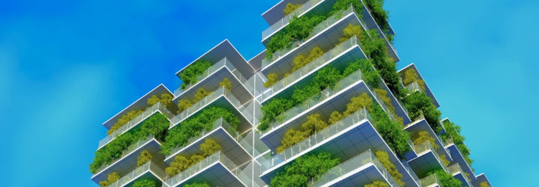 Edificio moderno con balcones llenos de vegetación y un cielo despejado de fondo.