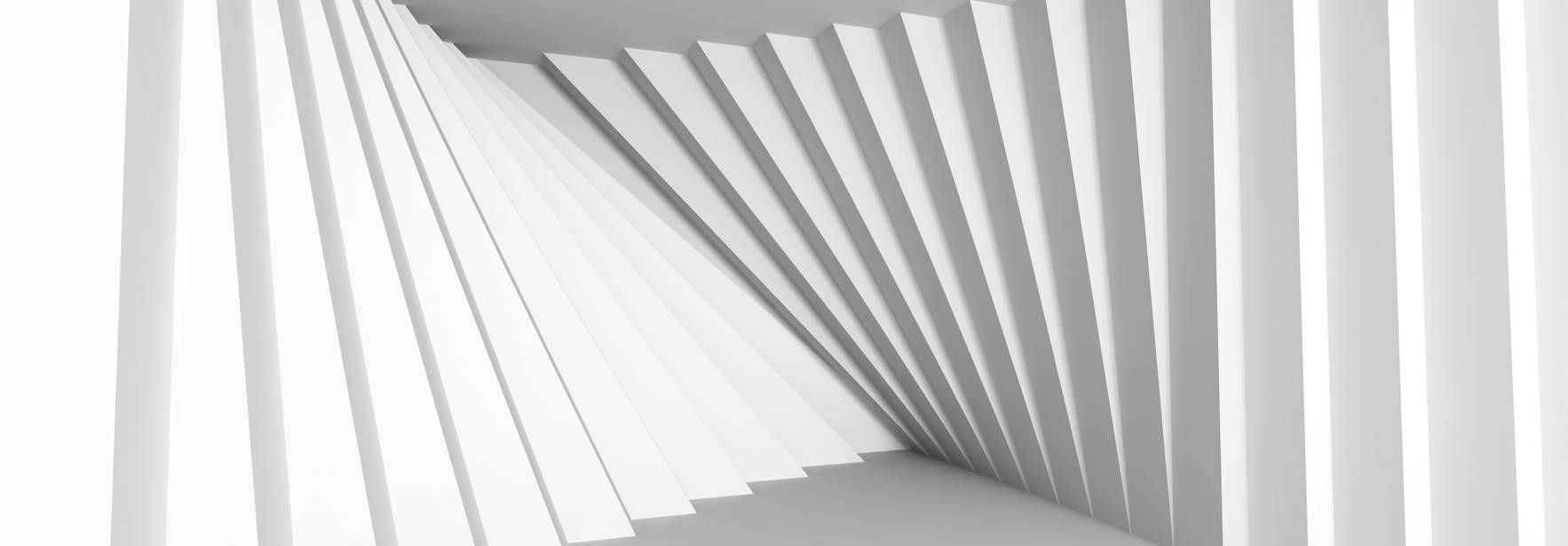 Un espacio arquitectónico abstracto con paredes en ángulo y una paleta de colores blancos.