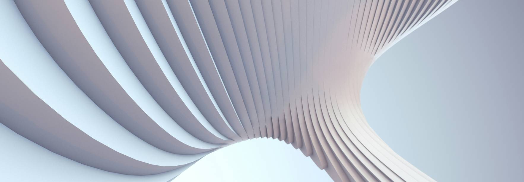 Una imagen abstracta que muestra una serie de líneas curvas y onduladas en tonos suaves.
