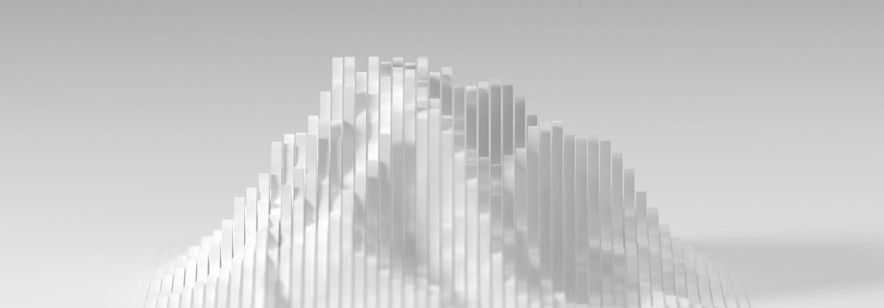 La imagen muestra una estructura en forma de montaña compuesta por múltiples barras verticales blancas que crean un efecto tridimensional.