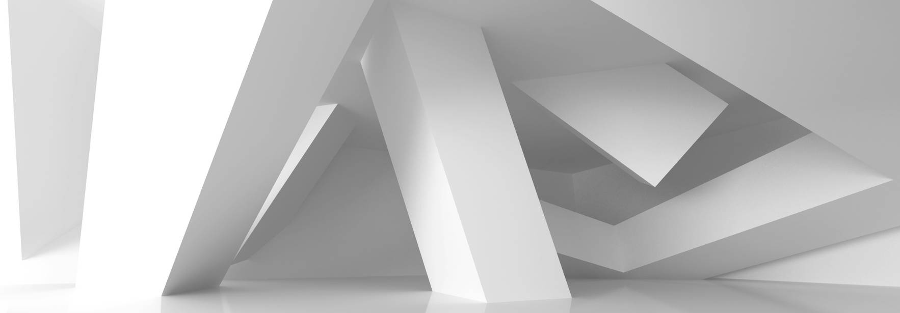La imagen muestra un espacio arquitectónico minimalista con formas geométricas blancas en diferentes ángulos.