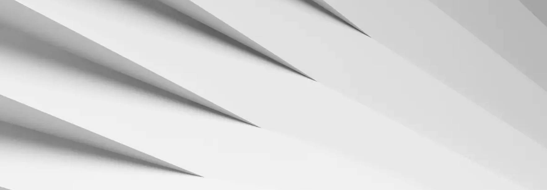 La imagen muestra una serie de planos en tonos blancos que crean un efecto de profundidad y perspectiva.