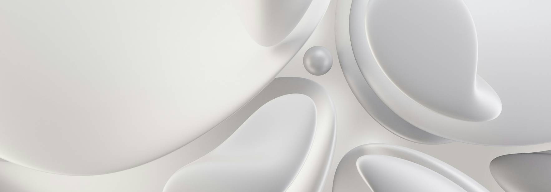 La imagen muestra una serie de formas fluidas y suaves en tonos blancos y grises interconectadas entre sí.