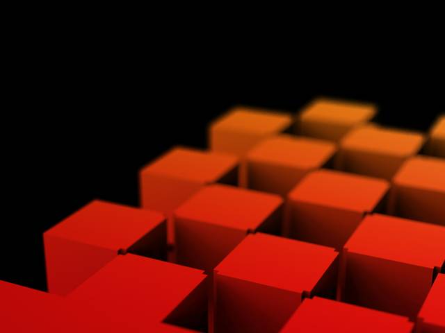 Una serie de bloques en tonos rojos y naranjas sobre un fondo negro.