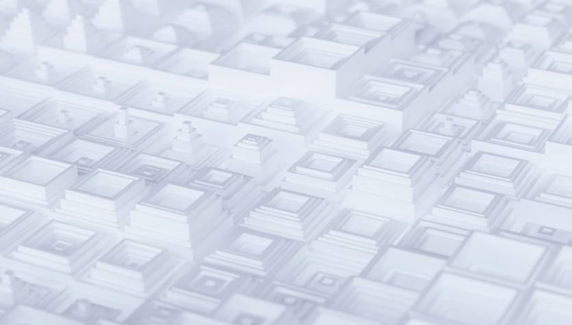 La imagen muestra una superficie abstracta compuesta por formas geométricas de diferentes tamaños y alturas en tonos claros.