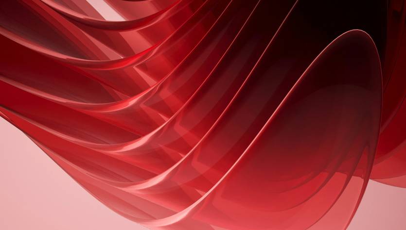 Una serie de ondas rojas brillantes que se entrelazan en un fondo suave.