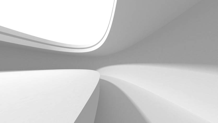 Una imagen con un diseño arquitectónico moderno, que presenta formas curvas y un ambiente minimalista en tonos blancos.