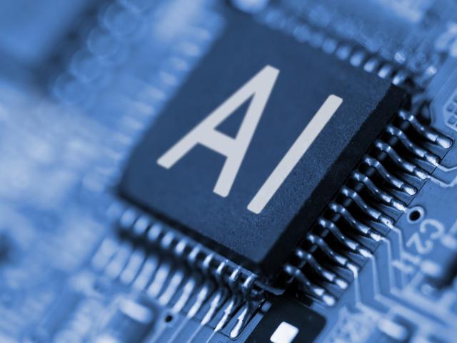 La imagen muestra un chip de ordenador con la inscripción 'AI' en un fondo azul.