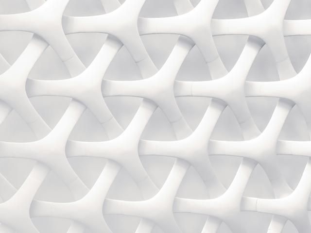 La imagen muestra una textura blanca con un patrón entrelazado de formas fluidas.